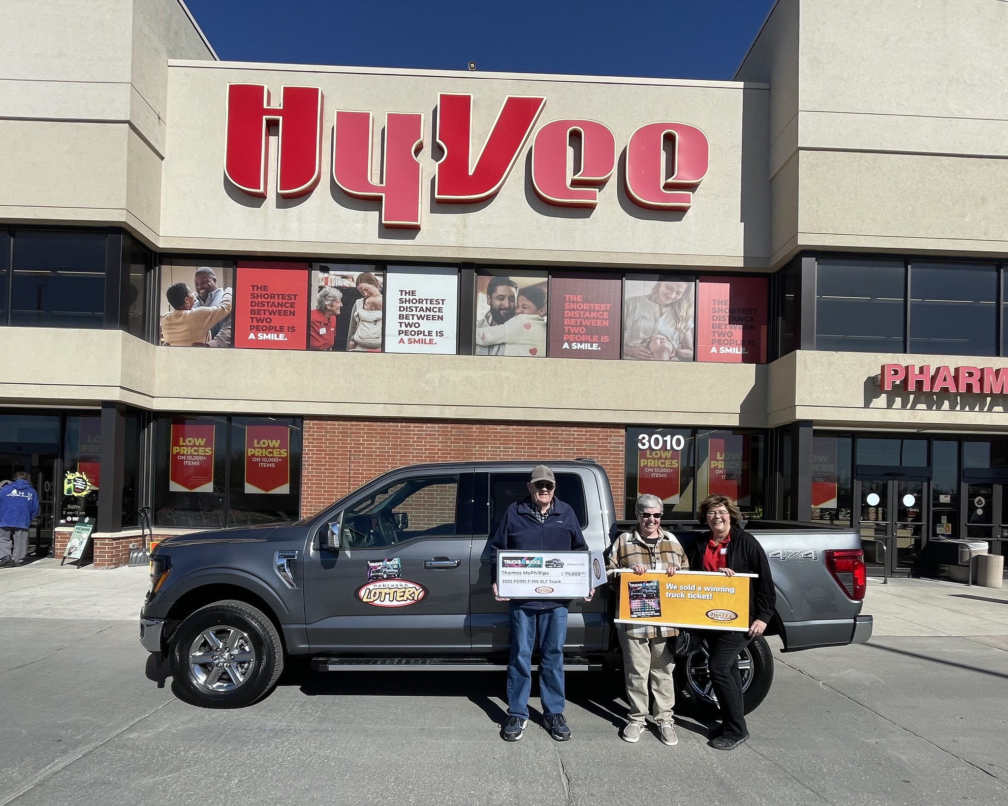 Thomas McPhillips stands in front of his new Ford F-150 Truck at Hy-Vee Food Store #1078 in Columbus